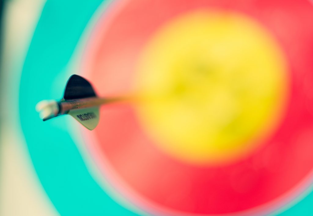 Colorful dart board with bullseye.