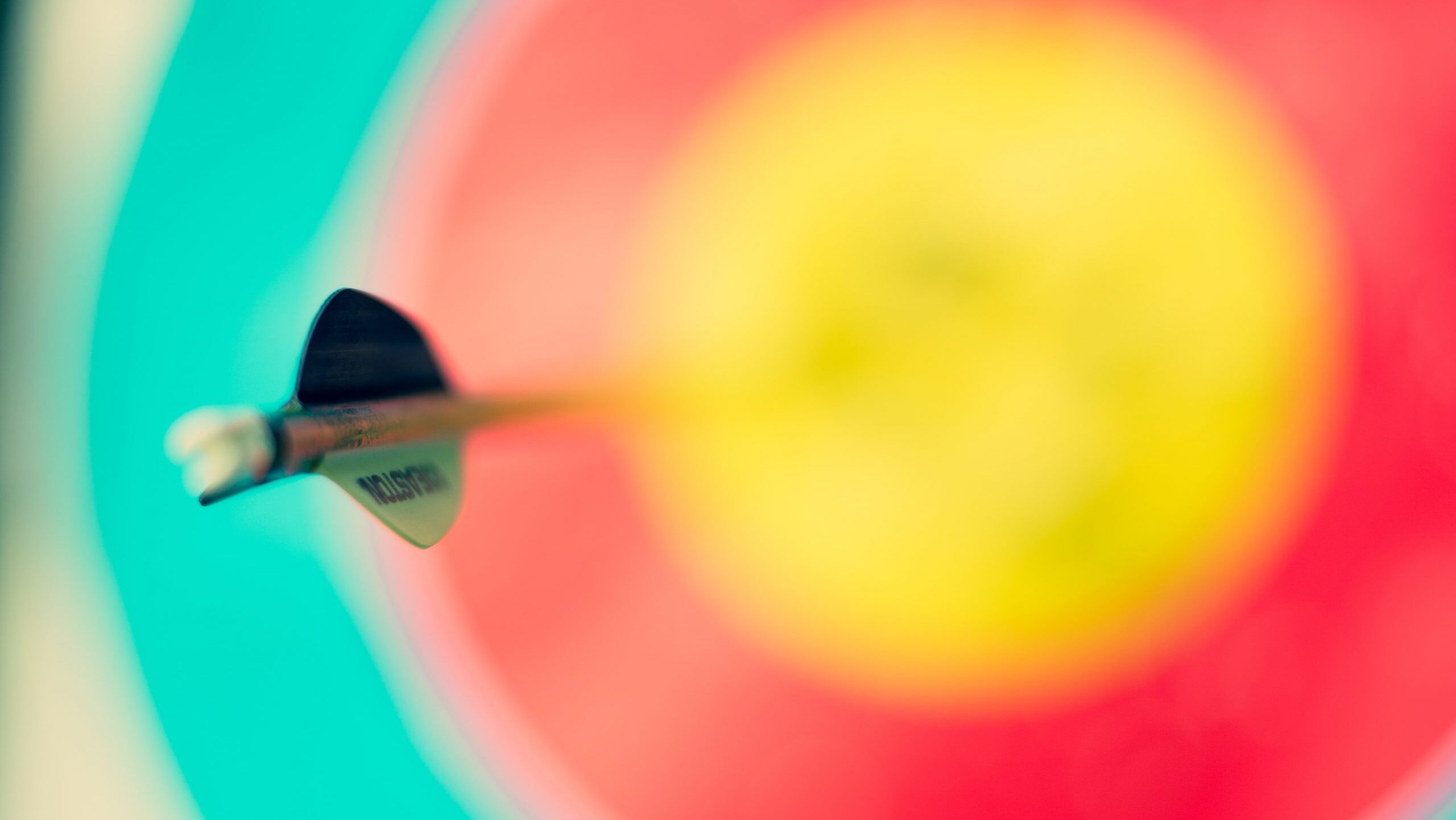 Colorful dart board with bullseye.
