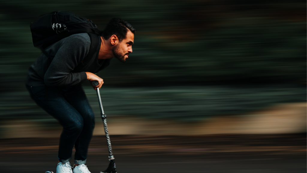 Man scootering at high speed.