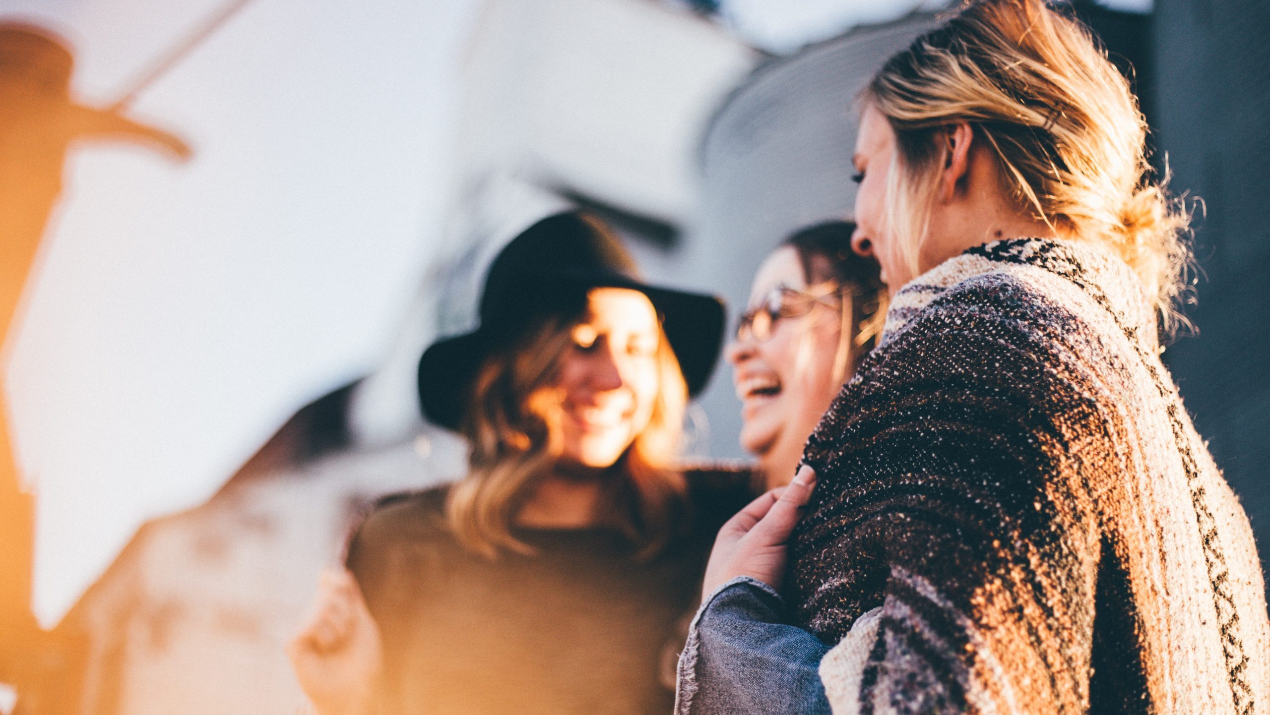 Three women talking.