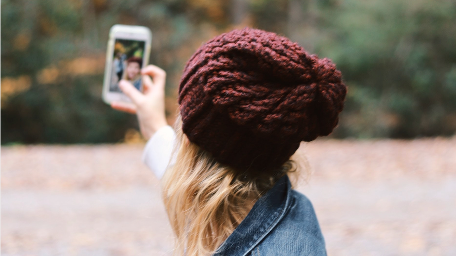 Woman taking selfie.