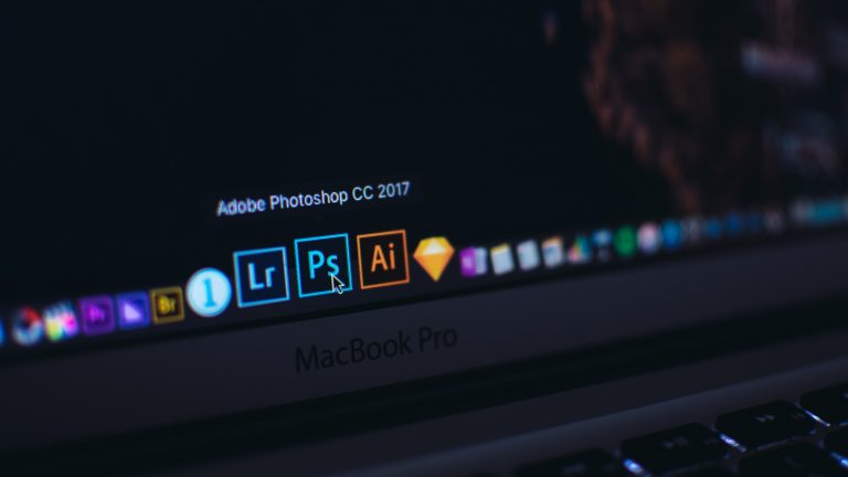 Photoshop icons on a laptop.
