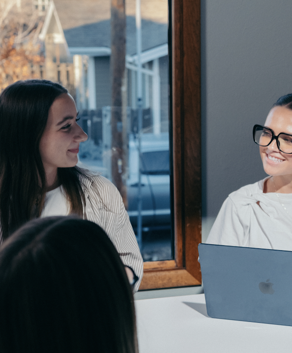 Digital marketing interns in the conference room working.